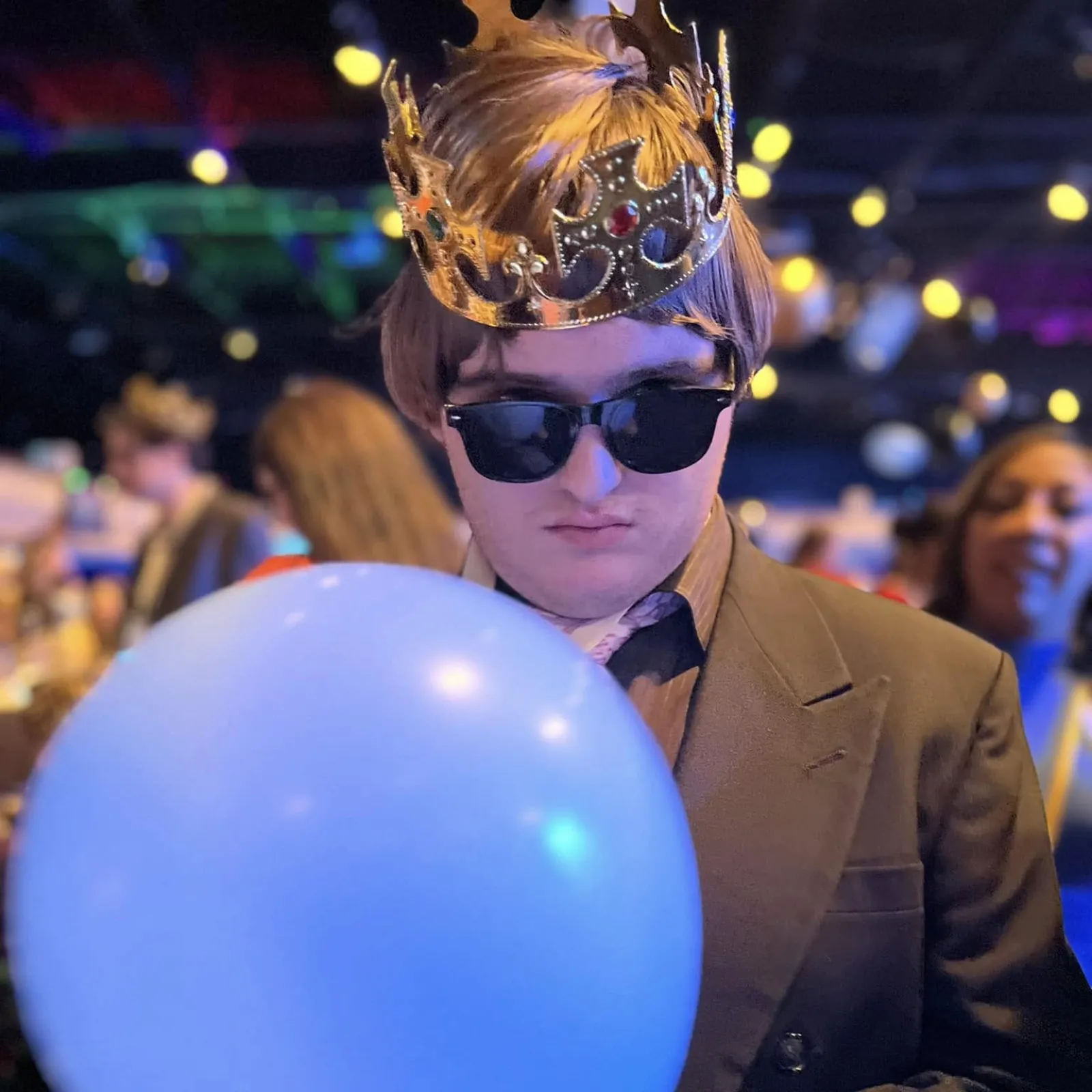 Devin Wearing Sunglasses and Holding a Balloon