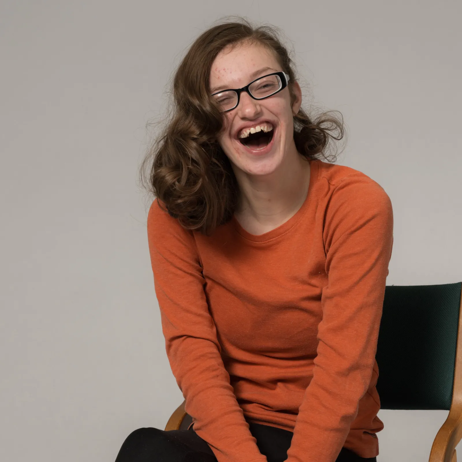 Lily Skeldon Seated and Smiling at the Camera